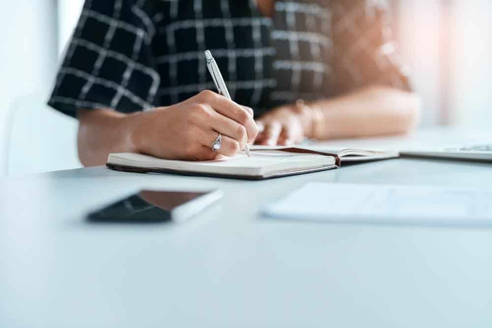 A man writing down TCEQ requirements for SWPPP.
