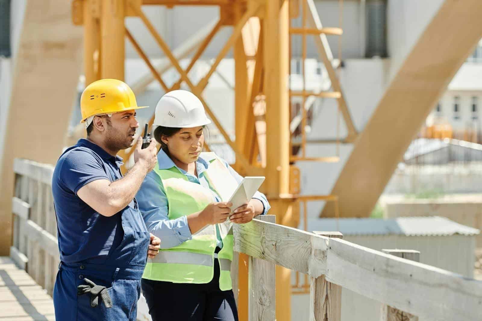 Two people making sure that the construction site is clean based on stormwater BMPs